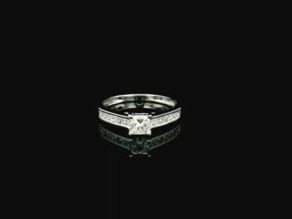 Princess cut diamond engagement ring in 18K white gold with channel set diamonds