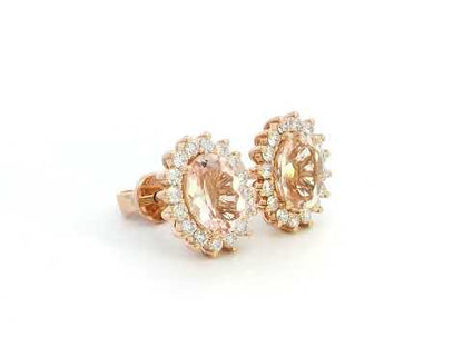 Diana-style 18K rose gold halo stud earrings featuring oval-cut morganites (2.77 carats) and round-cut diamonds (0.56 carats) in a regal, vintage-inspired design.