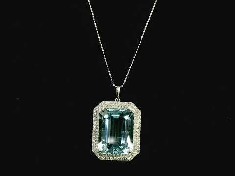 Emerald-cut aquamarine and diamond halo pendant in 18K white gold with large natural aquamarine center stone