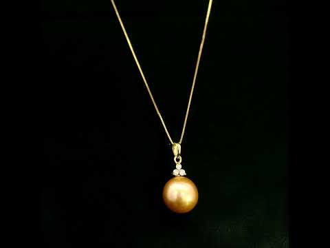 South Sea Golden Pearl and diamond pendant in 18K yellow gold featuring a 10 x 13 mm golden pearl and round diamond accents