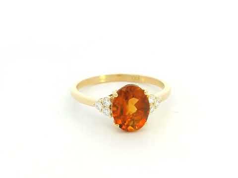 Oval citrine and diamond ring in 18K yellow gold with natural citrine center stone and diamond side accents