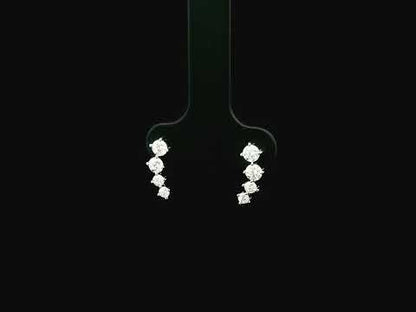 Graduated natural diamond drop earrings in 18K white gold, 0.55 carat total diamond weight.