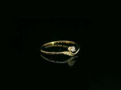 Minimalist diamond ring in 18K yellow gold with curved band and 0.07 carat total diamond weight, elegant everyday design by Emirates Diamonds