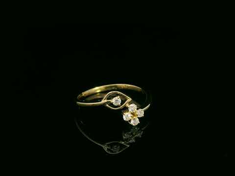 18K yellow gold diamond bypass ring with floral cluster design, 0.16 carat diamonds, modern fine jewelry by Emirates Diamonds