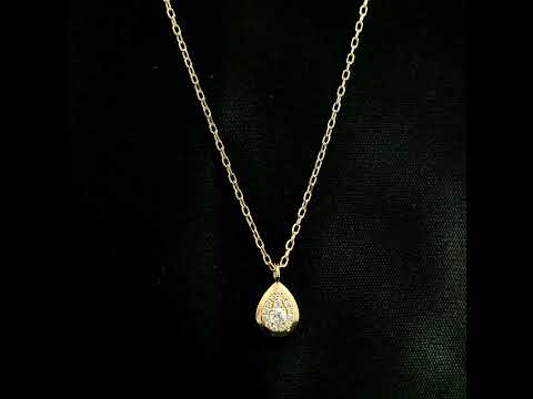 Diamond teardrop pendant necklace in 18K yellow gold featuring round brilliant diamonds arranged within a pear-shaped gold frame.