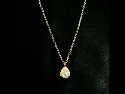 Diamond teardrop pendant necklace in 18K yellow gold featuring round brilliant diamonds arranged within a pear-shaped gold frame.