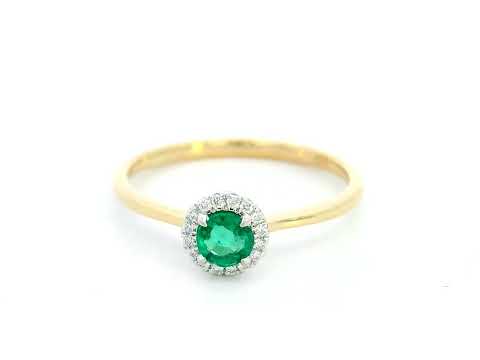 Dainty 18K gold stacking ring with a 0.25 carat emerald and 0.06 carat diamonds, perfect for fine jewelry lovers and everyday elegance.