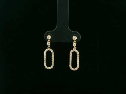 18K yellow gold diamond drop earrings featuring an elongated pavé-set oval design by Emirates Diamonds.