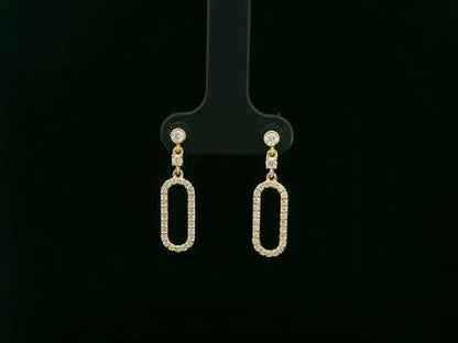 18K yellow gold diamond drop earrings featuring an elongated pavé-set oval design by Emirates Diamonds.