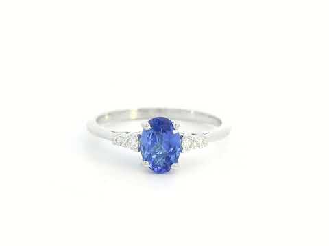 Elegant 0.94-carat oval Tanzanite and 0.10-carat Diamond ring in 18K white gold, perfect for engagements, anniversaries, and December birthstone jewelry