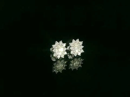 Round and baguette diamond cluster stud earrings in 18K white gold with 0.96 carat natural diamonds by Emirates Diamonds.