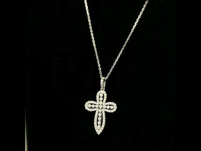Openwork diamond cross pendant in 18K white gold with round diamond borders, central diamond accents and a diamond-set bail, displayed on a chain.