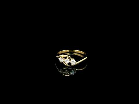 Three stone diamond ring in 18K yellow gold with round diamonds and flowing open band design