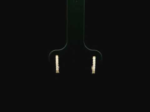 18K yellow gold diamond huggie hoop earrings featuring 0.09 carats of natural diamonds in a classic everyday hoop design.