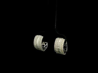 Baguette and round diamond hoop earrings in 18K white gold featuring a central baguette diamond row framed by round brilliant diamonds.