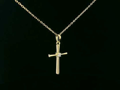18K yellow gold cross pendant with 0.05 carat center diamond, minimalist design, chain not included