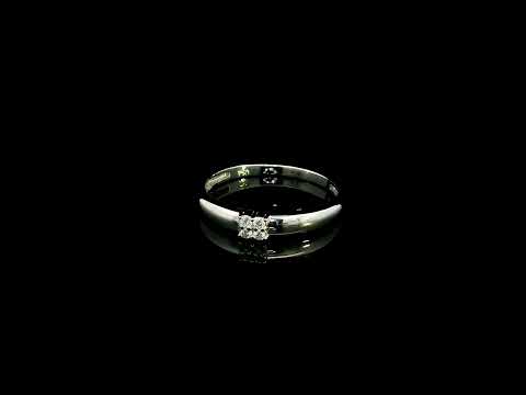 Minimalist natural diamond ring crafted in 18K white gold featuring a polished band with a four-diamond cluster.