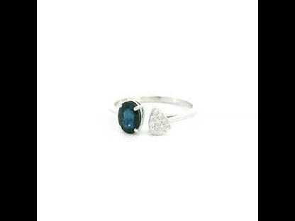 18K white gold blue sapphire diamond open ring featuring a 1.07 Carat natural oval sapphire with a pear-shaped natural diamond cluster.