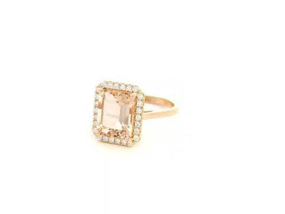 Emerald cut morganite halo ring with diamonds in 18K rose gold by Emirates Diamonds