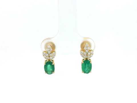 Emerald and diamond accent earrings in 18K yellow gold featuring 1.14 carat emeralds and 0.19 carat diamonds by Emirates Diamonds.