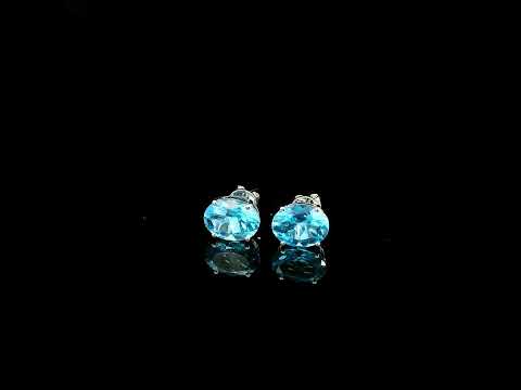 18K white gold Swiss Blue Topaz stud earrings featuring round natural Swiss Blue Topaz gemstones with a total weight of 3.75 carats in classic four-prong settings.