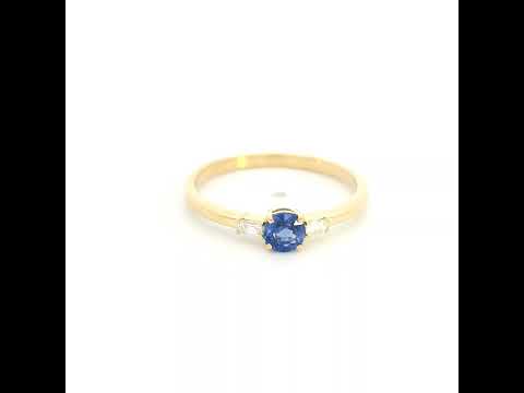 Round blue sapphire and baguette diamond three stone ring in 18K yellow gold