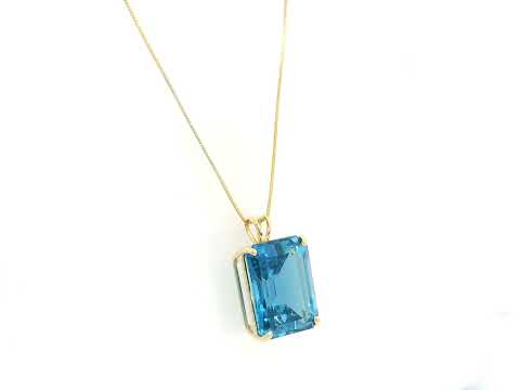 London Blue Topaz pendant in 18K yellow gold featuring a 14.77 carat emerald-cut natural London Blue Topaz