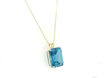 London Blue Topaz pendant in 18K yellow gold featuring a 14.77 carat emerald-cut natural London Blue Topaz