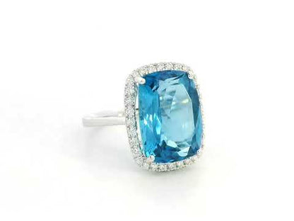 Blue Topaz & Diamond Halo Ring in 18K White Gold