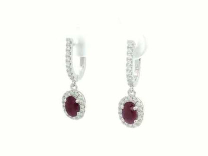 Elegant oval-cut Ruby and diamond halo drop earrings in 18K white gold, featuring 1.40 carats of deep red Rubies and 0.43 carats of sparkling diamonds.