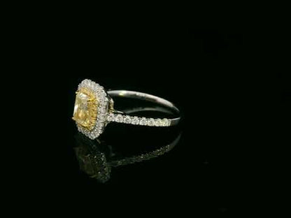 18K white gold fancy yellow radiant-cut diamond ring with yellow inner halo and white diamond outer halo by Emirates Diamonds.
