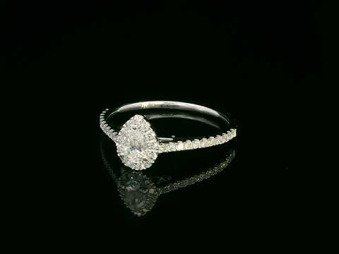 18K gold pear-cut diamond halo ring with a 0.25ct center stone and accent diamonds on a delicate band.