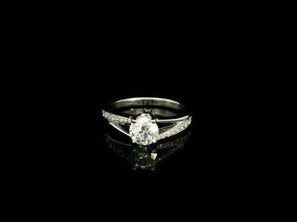 Round Diamond Twist Engagement Ring in 18K White Gold