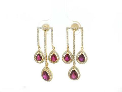 2.65 carat pear ruby and 0.91 carat diamond halo drop earrings in 18K yellow gold by Emirates Diamonds