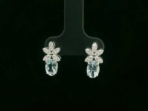 Video of 18k gold drop earrings with oval aquamarines and floral diamond cluster