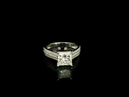 Natural princess cut diamond engagement ring in 18K white gold featuring a 2.19 carat IGI-certified F colour VS1 clarity centre diamond and 0.42 carat of round diamonds along the pavé-set band.