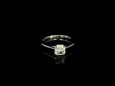 Radiant cut diamond solitaire engagement ring in 18K white gold with a four-prong setting and polished band.