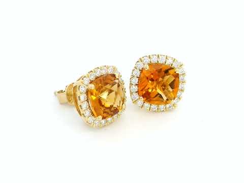 18K yellow gold cushion-cut citrine and diamond halo earrings with 3.91 carats of citrine and 0.57 carats of diamonds.