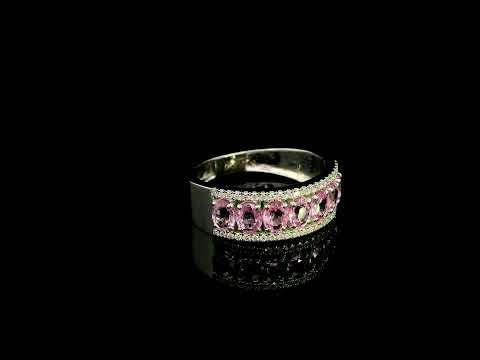 Pink sapphire and diamond band ring in 18K white gold featuring oval pink sapphires framed by two rows of sparkling diamonds.