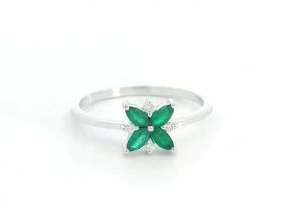 18K gold floral ring featuring 0.31 CT natural emeralds and 0.05 CT diamonds, designed in a delicate flower shape.