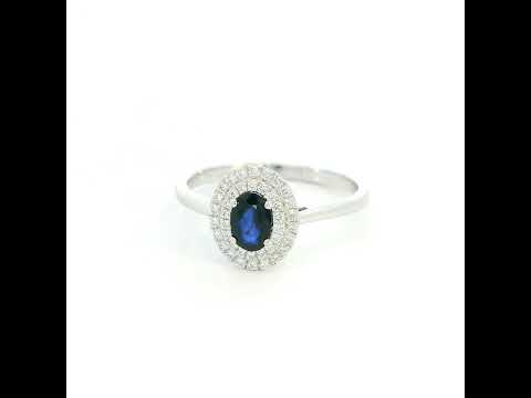 Oval blue sapphire double diamond halo ring in 18K white gold by Emirates Diamonds
