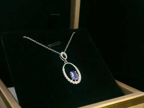 18K white gold tanzanite and diamond oval pendant featuring a 0.47ct violet-blue tanzanite and 0.21ct diamonds, designed for layering