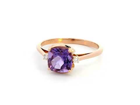18K gold ring with a 1.51-carat cushion-cut purple amethyst center stone, accented by two round diamonds totaling 0.04 carat.