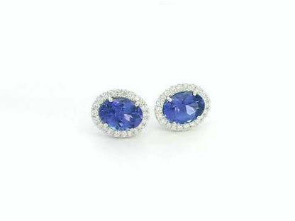 Tanzanite and diamond halo stud earrings in 18K white gold by Emirates Diamonds.