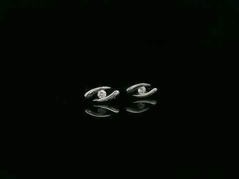 18K white gold modern diamond stud earrings with sculptural swirl design and round diamonds, total diamond weight 0.12 carat, Emirates Diamonds.