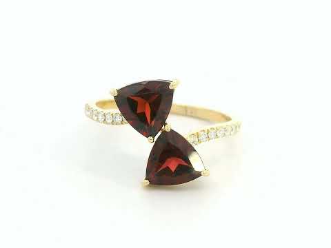 18K yellow gold open bypass ring with trillion-cut garnets and pavé diamonds, modern luxury design