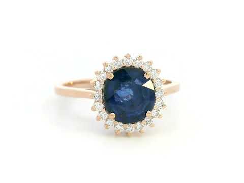 Blue sapphire and diamond halo ring in 18K rose gold with 2.02 carat sapphire and vintage-inspired setting