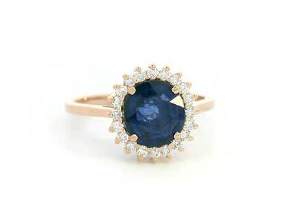 Blue sapphire and diamond halo ring in 18K rose gold with 2.02 carat sapphire and vintage-inspired setting