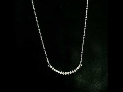 Diamond curved bar necklace in 18K white gold featuring a gently curved row of round diamonds with a total weight of 0.18 carat, connected to a fine white gold chain.