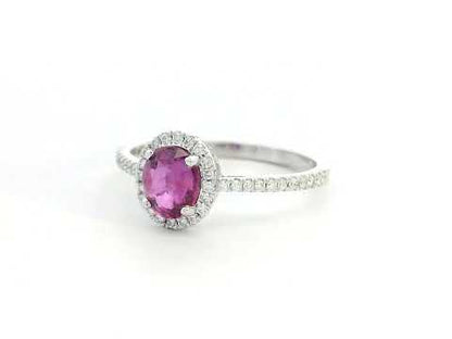 18K gold pink sapphire halo ring with 0.99 Ct oval pink sapphire and 0.22 Ct diamond accents, luxury gemstone jewelry